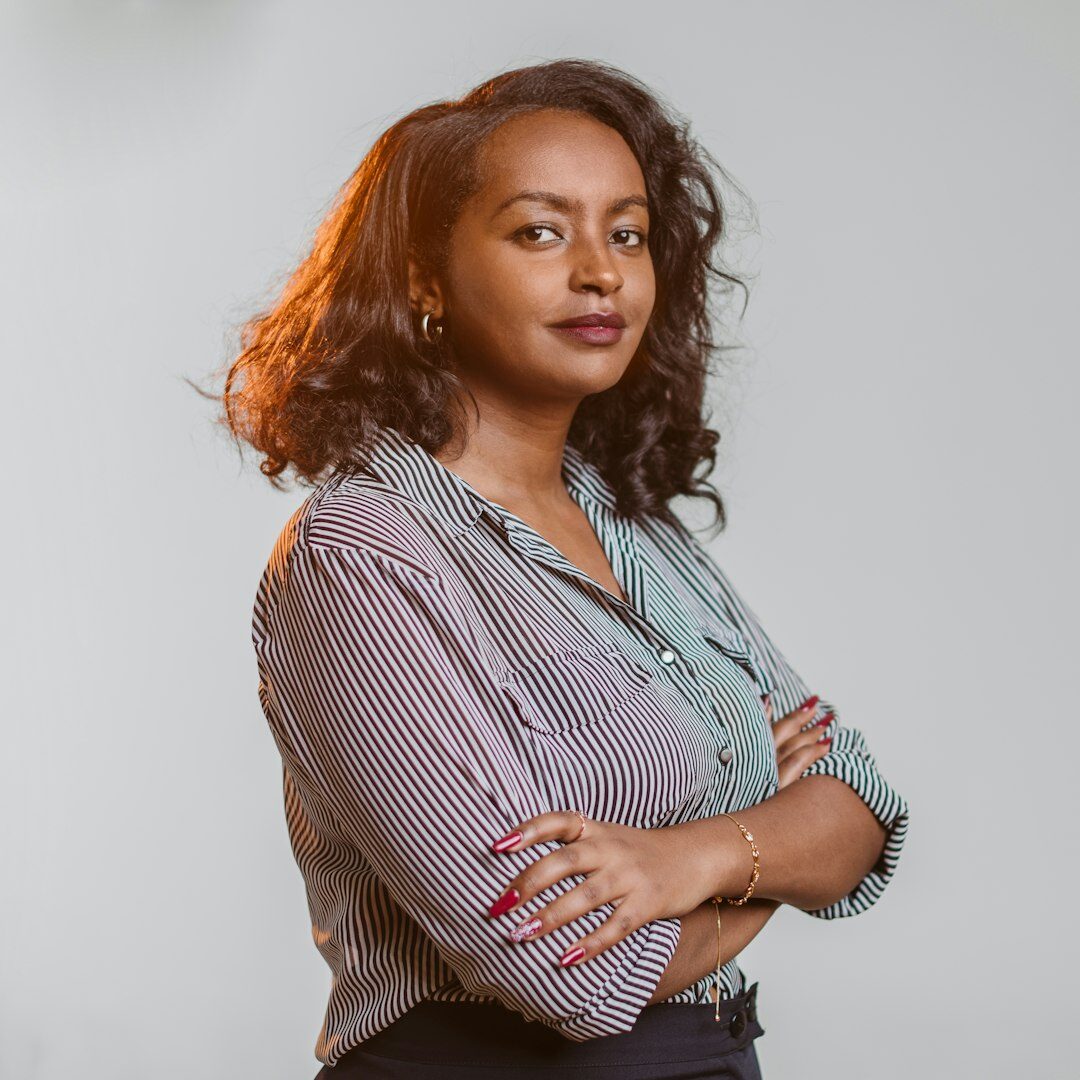 Studio portrait of a smiling Brazilian woman with straight dark hair